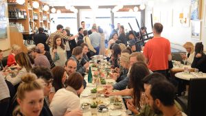 Large group of people eating in a restaurant